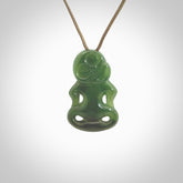 This pendant is a small jade tiki pendant. The carving shows wonderful detail on the front while the back is beautifully rounded. These are carved in Columbian Jade. The cord is adjustable in length. Provided in a woven kete pouch and shipped worldwide.